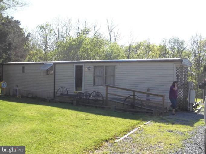 641 Co Rte 4/1 Kearneysville, WV 25430 - Photo 1 of 29 a view of a backyard with chairs