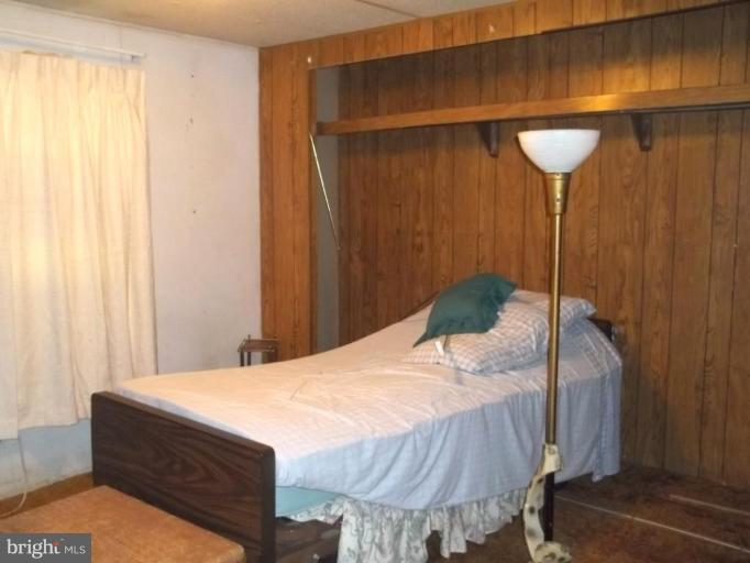 641 Co Rte 4/1 Kearneysville, WV 25430 - Photo 8 of 29 a bedroom with a bed and a chandelier
