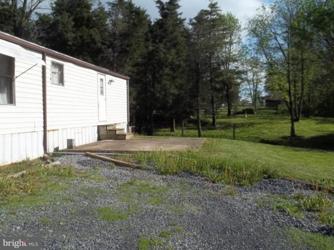 641 Co Rte 4/1 Kearneysville, WV 25430 - Photo 9 of 29 a view of a house with backyard and trees
