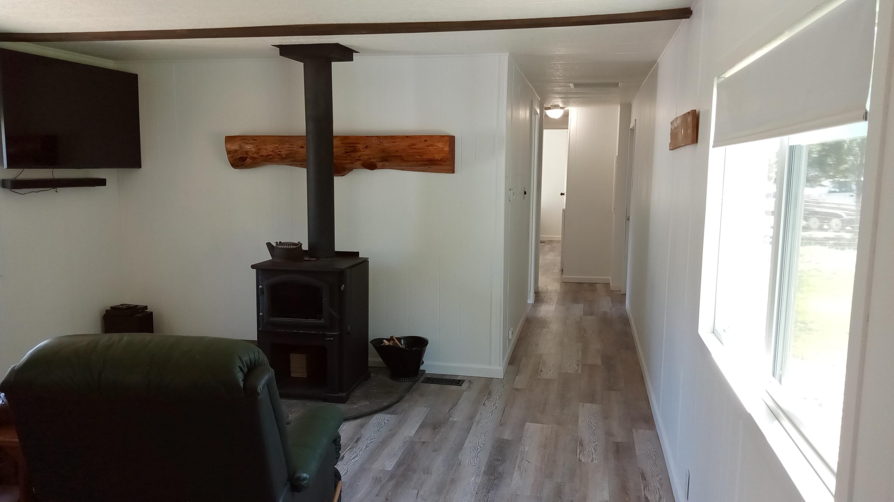 6616 Randy Road La Pine, OR 97739 - Photo 5 of 32 Certified wood stove, new vinyl wood grain floors throughout