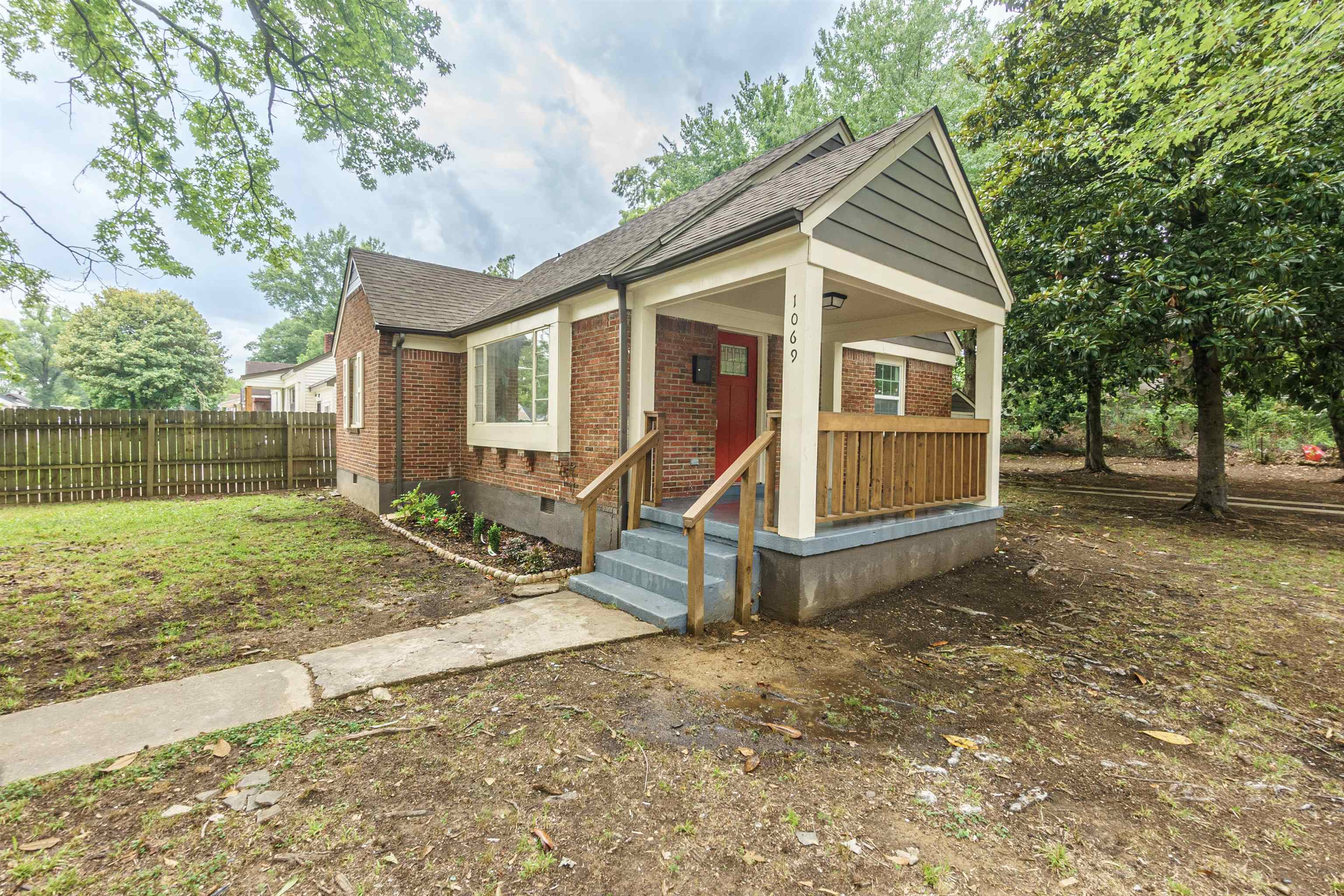 1069 Railton Road Memphis, TN 38111 - Photo 1 of 17 a view of a house with backyard and trees