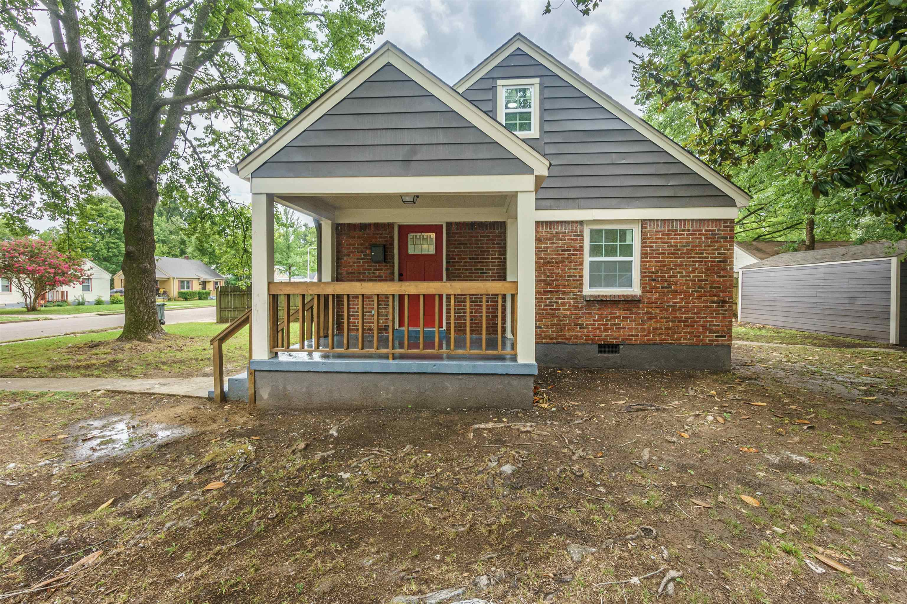 1069 Railton Road Memphis, TN 38111 - Photo 3 of 17 a view of a house with backyard and a tree