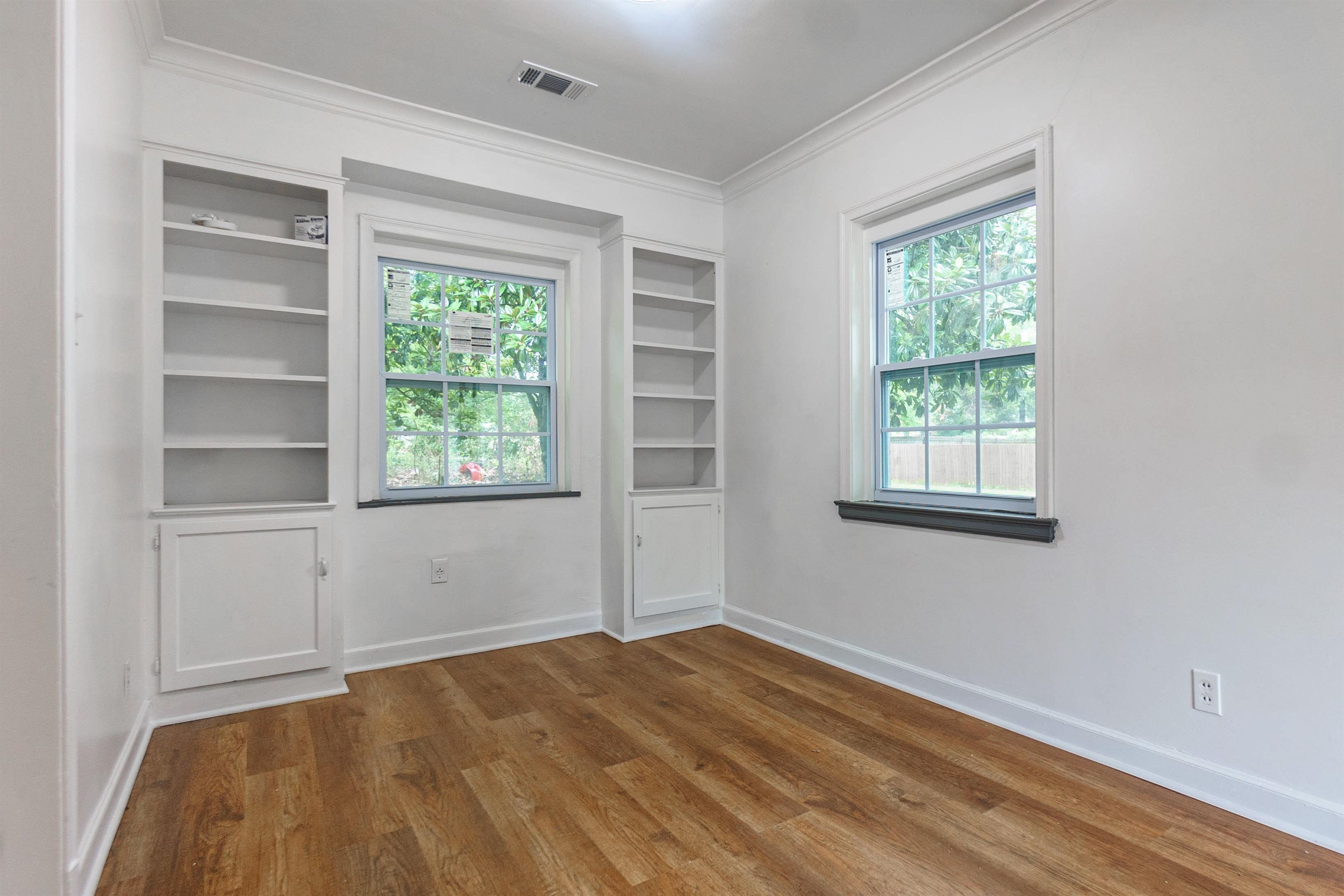 1069 Railton Road Memphis, TN 38111 - Photo 9 of 17 a view of empty room with window and wooden floor