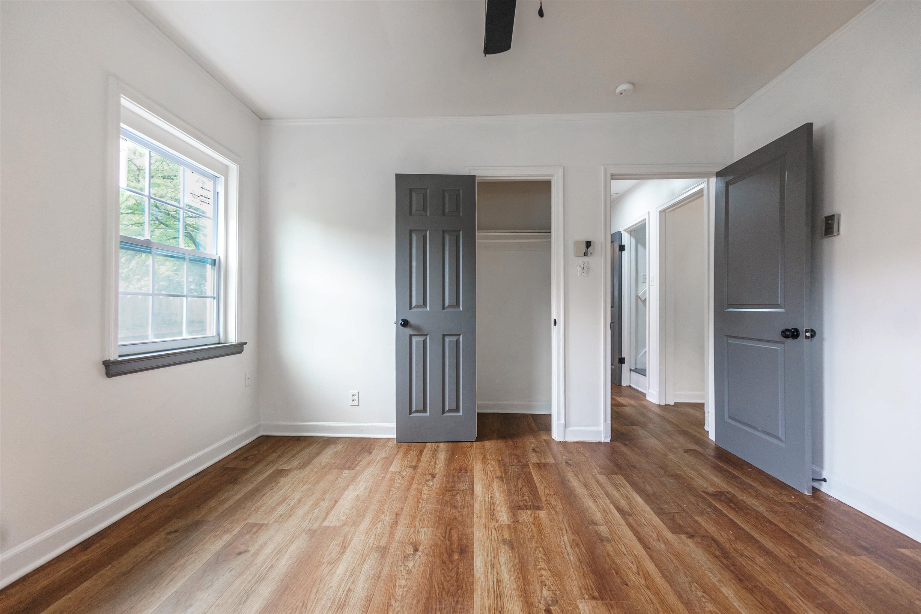 1069 Railton Road Memphis, TN 38111 - Photo 10 of 17 wooden floor in an empty room with a window