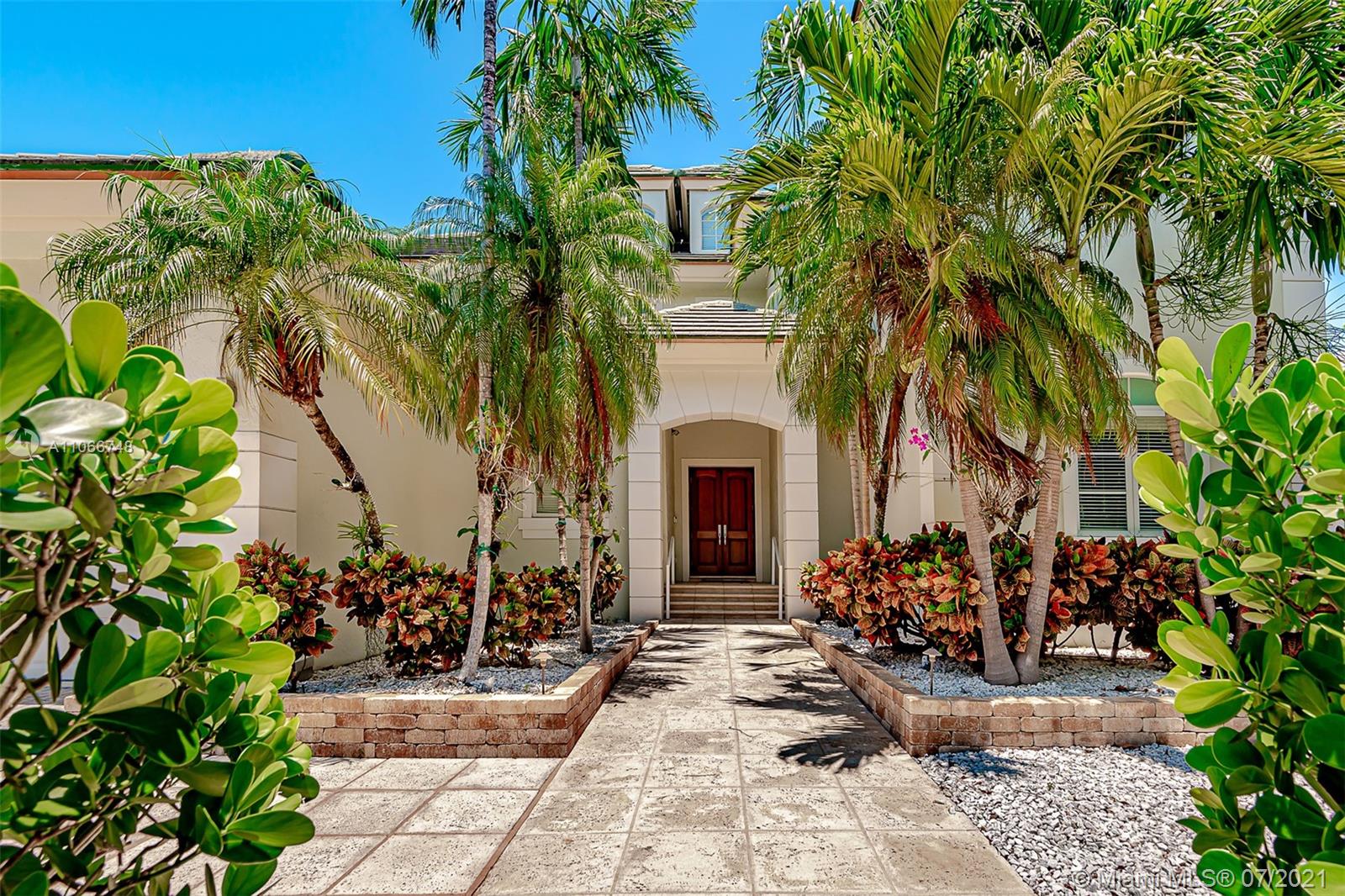 442 Woodcrest Road Key Biscayne, FL 33149 - Photo 1 of 48 a view of outdoor space yard and porch