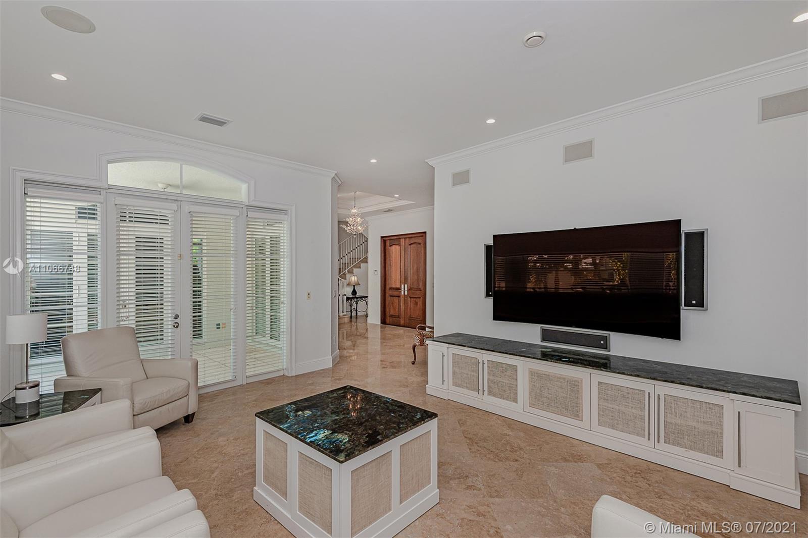 442 Woodcrest Road Key Biscayne, FL 33149 - Photo 11 of 48 a living room with furniture and a flat screen tv