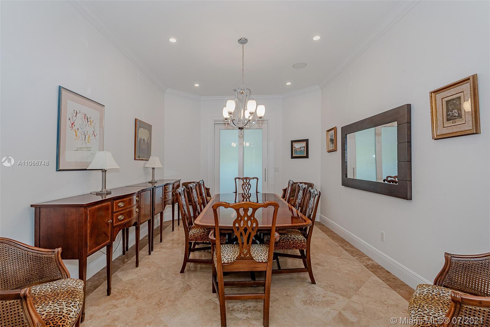 442 Woodcrest Road Key Biscayne, FL 33149 - Photo 17 of 48 a view of a dining room with furniture