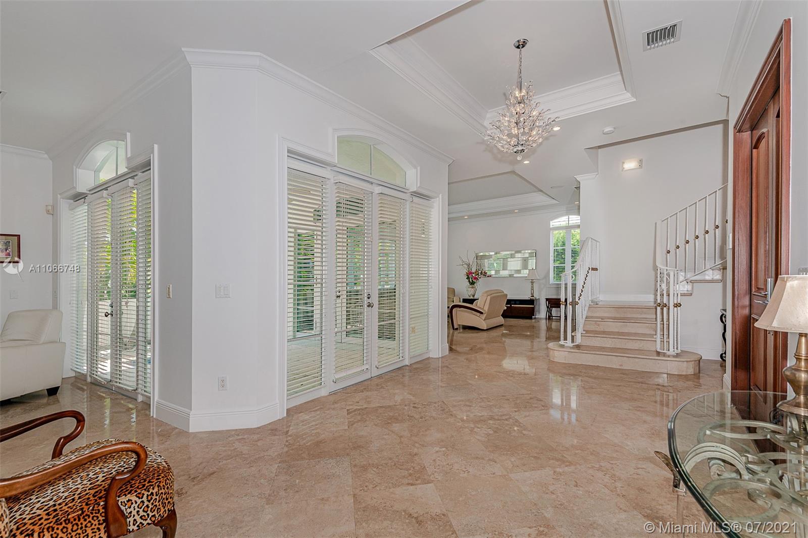 442 Woodcrest Road Key Biscayne, FL 33149 - Photo 18 of 48 a view of a livingroom with a flat screen tv