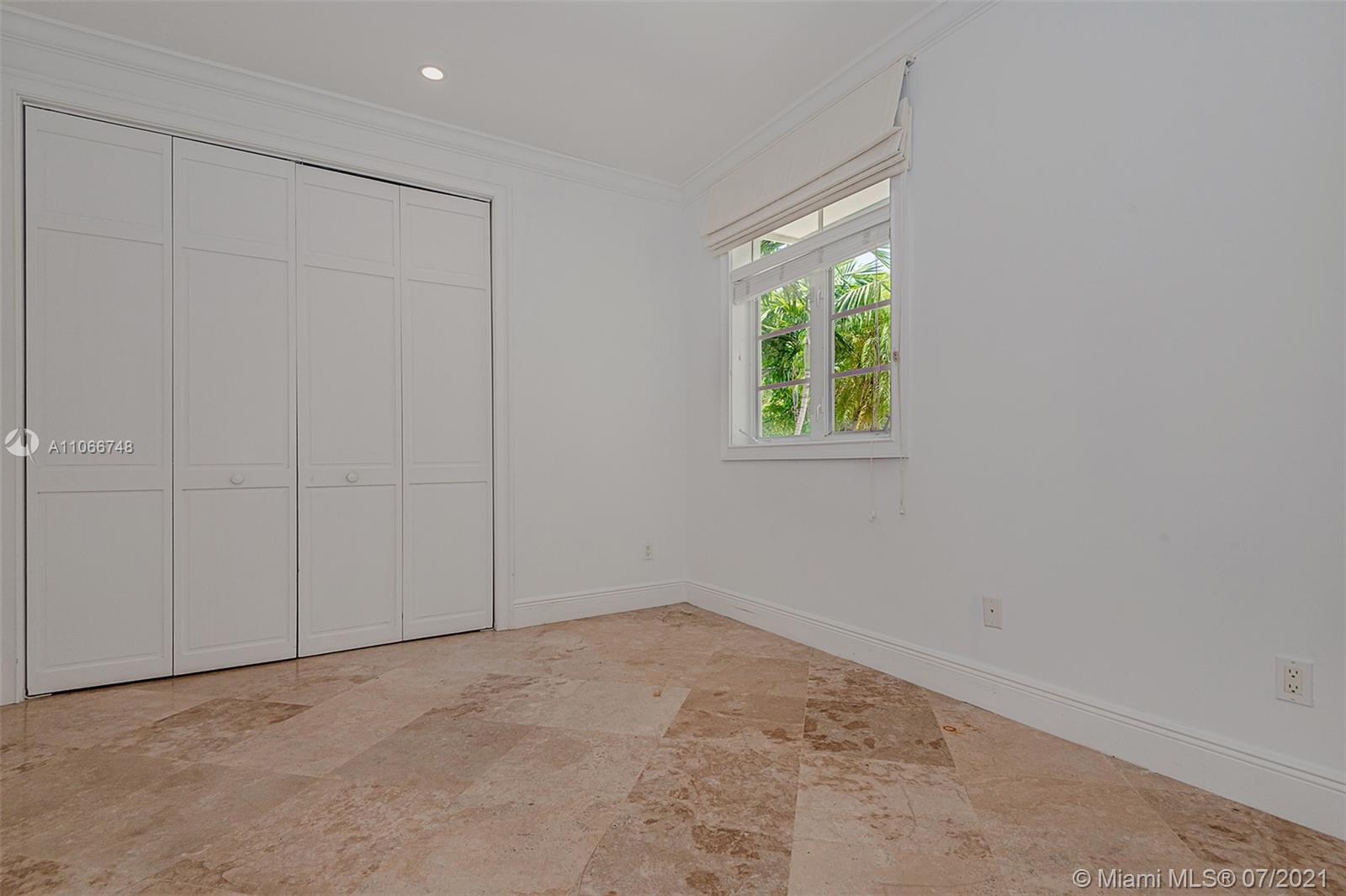 442 Woodcrest Road Key Biscayne, FL 33149 - Photo 19 of 48 an empty room with windows