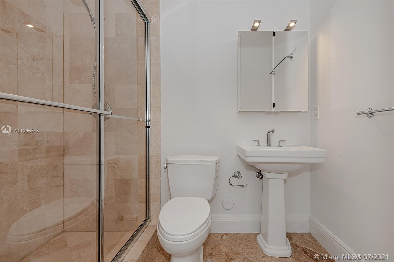 442 Woodcrest Road Key Biscayne, FL 33149 - Photo 21 of 48 a bathroom with a sink toilet and shower