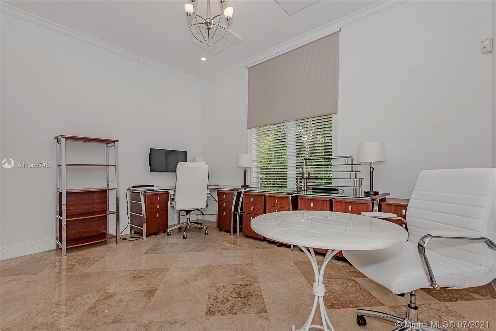 442 Woodcrest Road Key Biscayne, FL 33149 - Photo 23 of 48 a workspace with furniture and a window