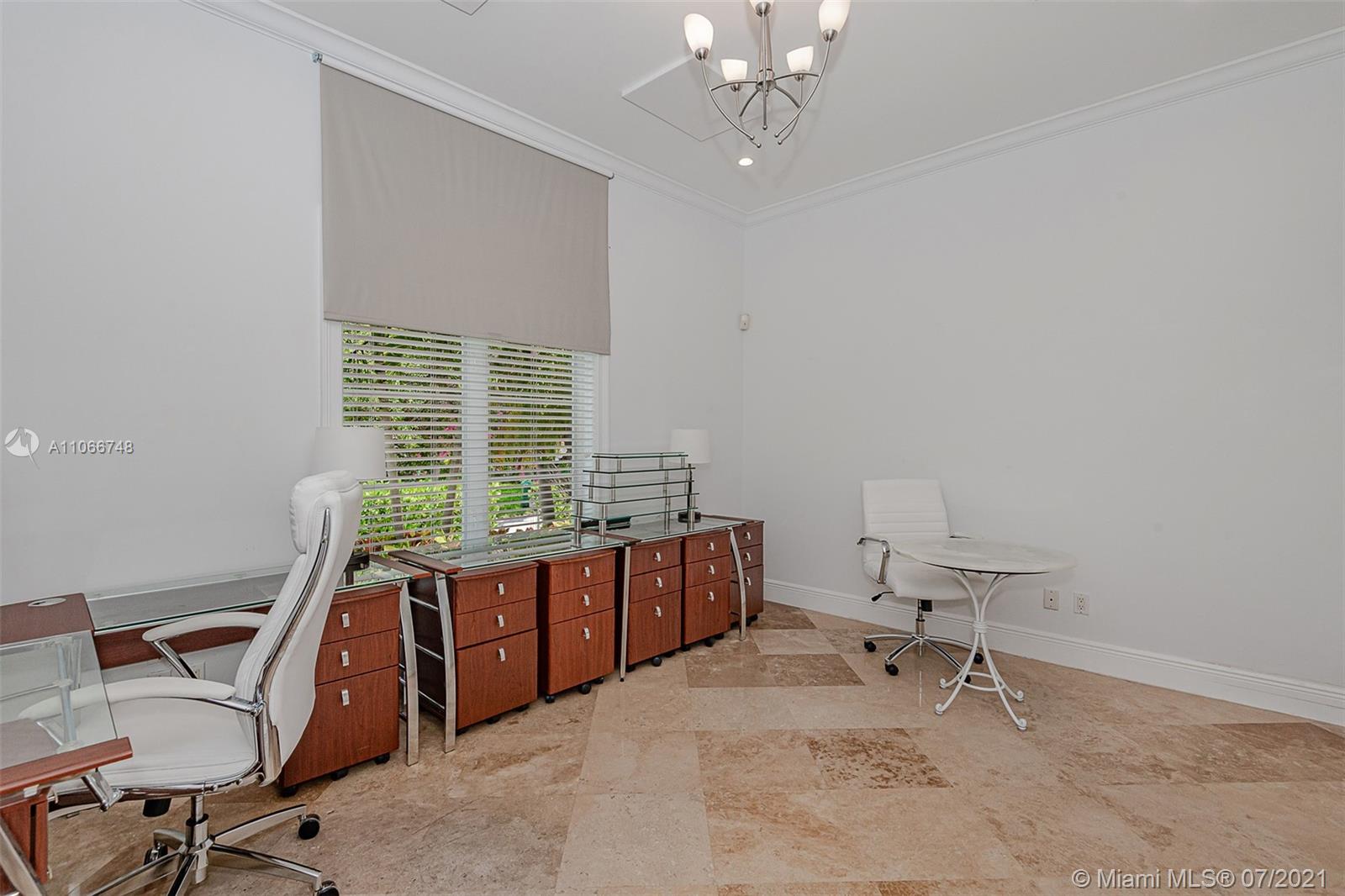 442 Woodcrest Road Key Biscayne, FL 33149 - Photo 24 of 48 a view of a workspace with furniture and a window