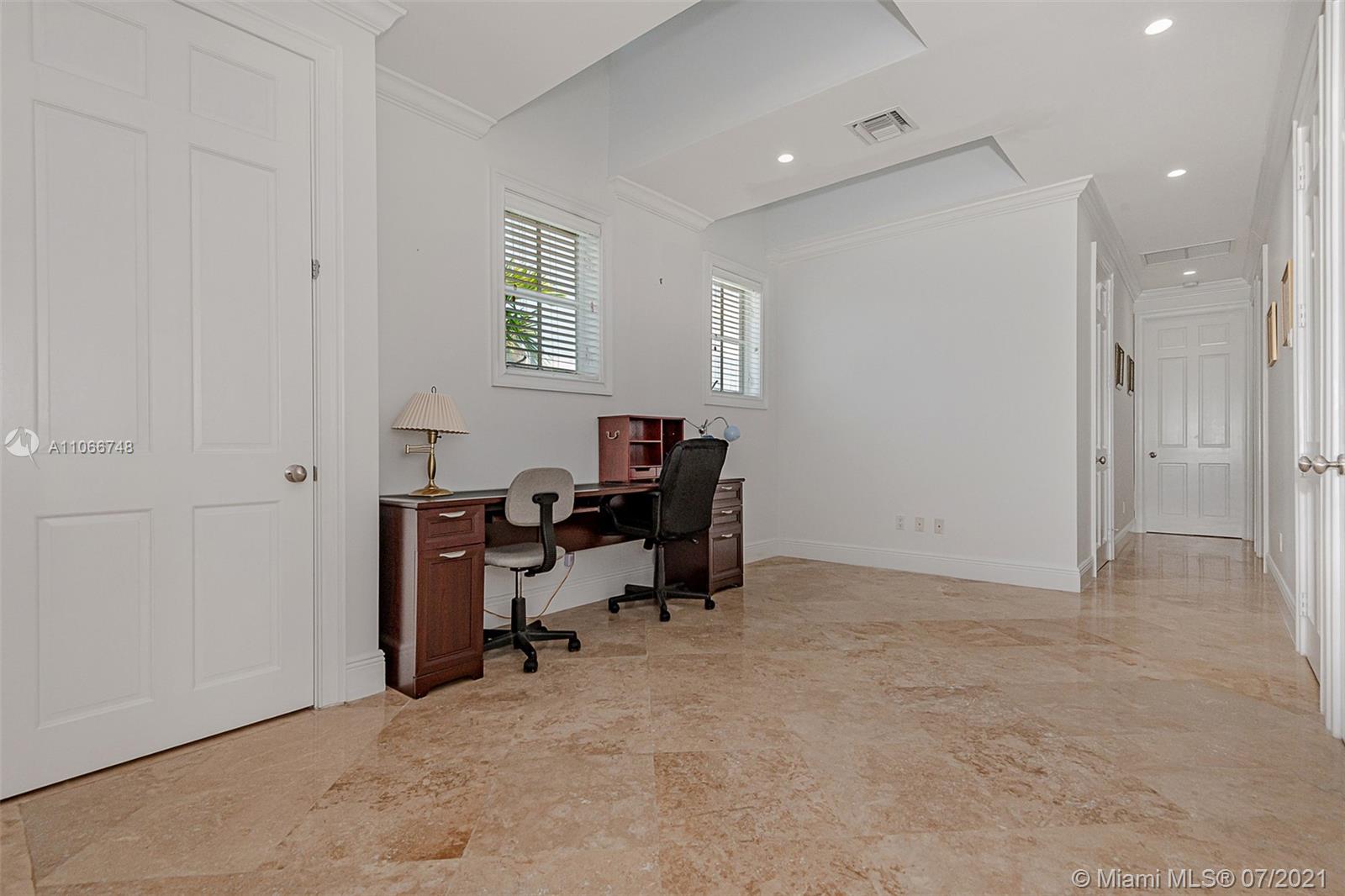 442 Woodcrest Road Key Biscayne, FL 33149 - Photo 27 of 48 a view of a workspace with furniture and a window
