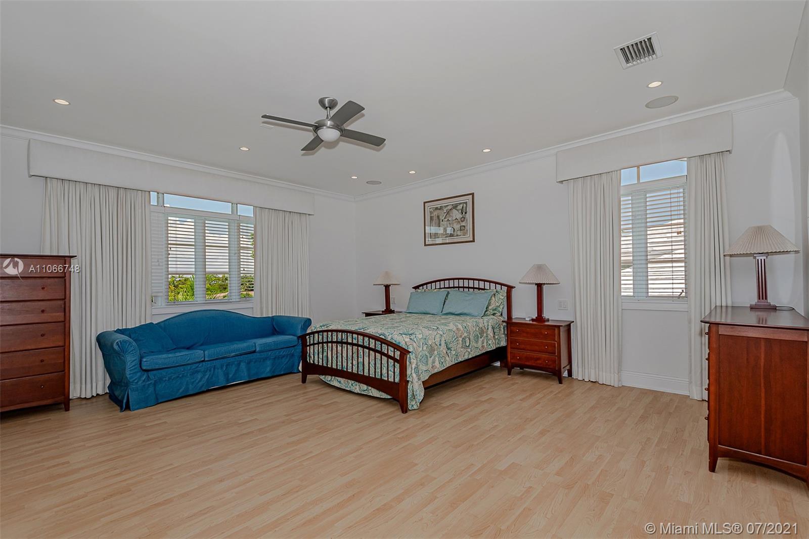 442 Woodcrest Road Key Biscayne, FL 33149 - Photo 28 of 48 a bedroom with furniture and window