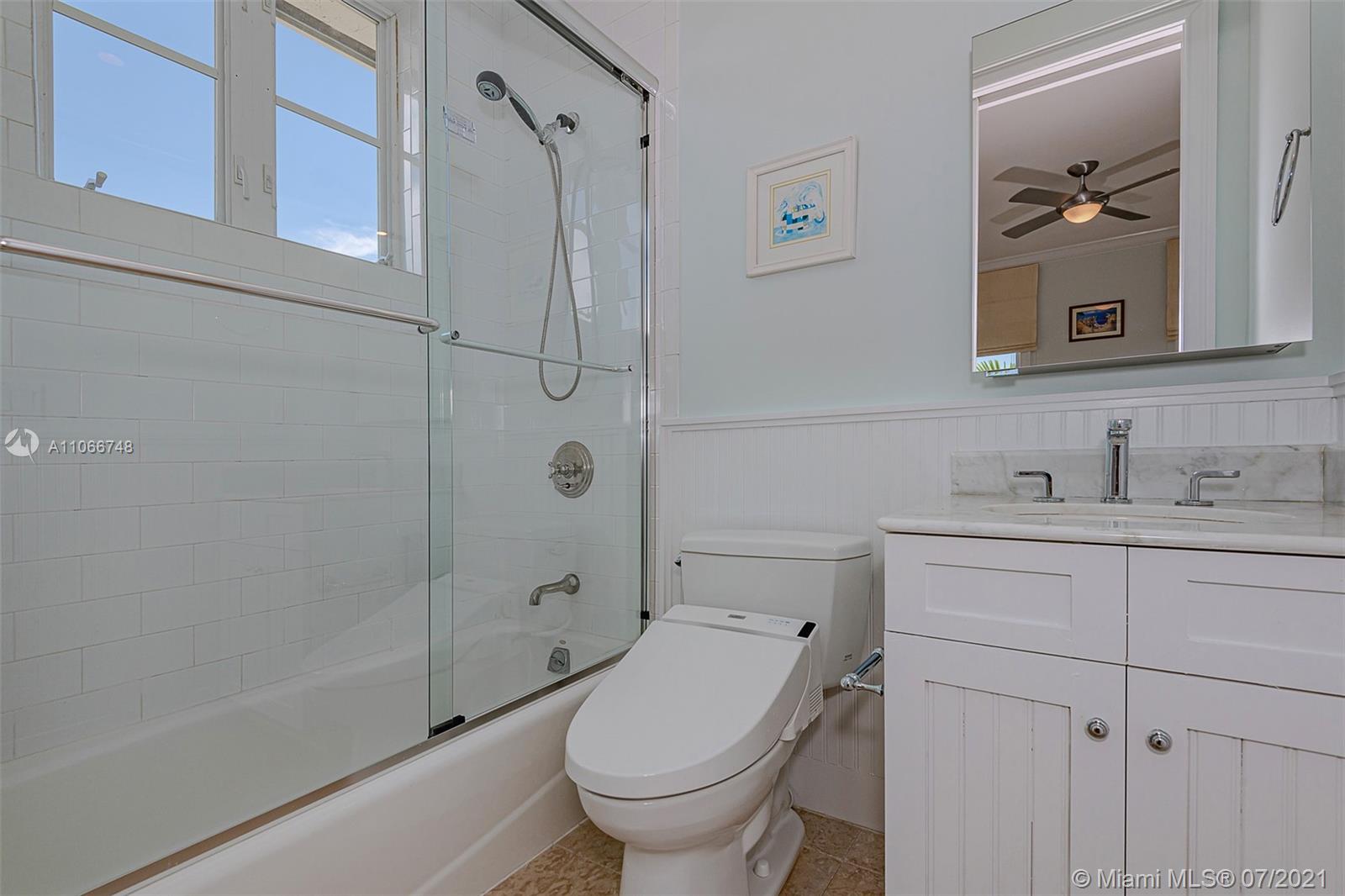 442 Woodcrest Road Key Biscayne, FL 33149 - Photo 38 of 48 a bathroom with a sink toilet and shower