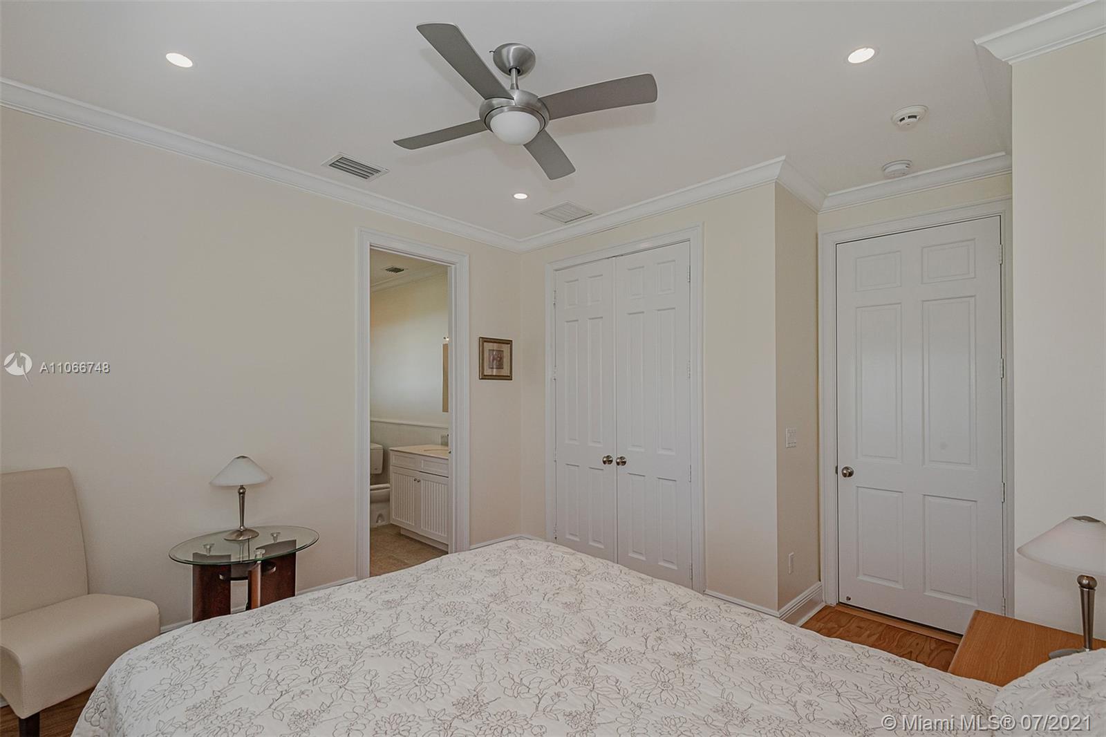 442 Woodcrest Road Key Biscayne, FL 33149 - Photo 40 of 48 a bedroom with a bed and a couch