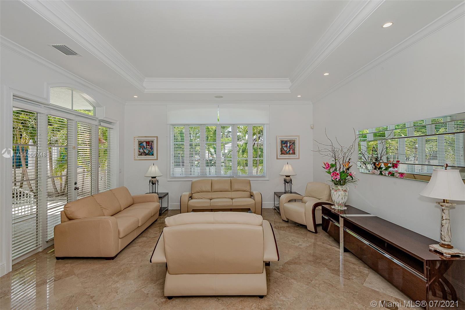 442 Woodcrest Road Key Biscayne, FL 33149 - Photo 5 of 48 a bedroom with furniture and a window