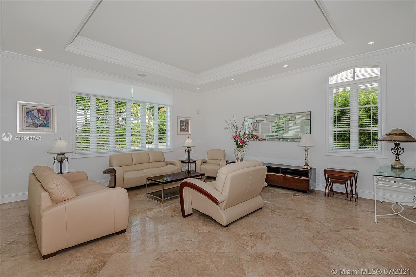 442 Woodcrest Road Key Biscayne, FL 33149 - Photo 6 of 48 a living room with furniture and a large window