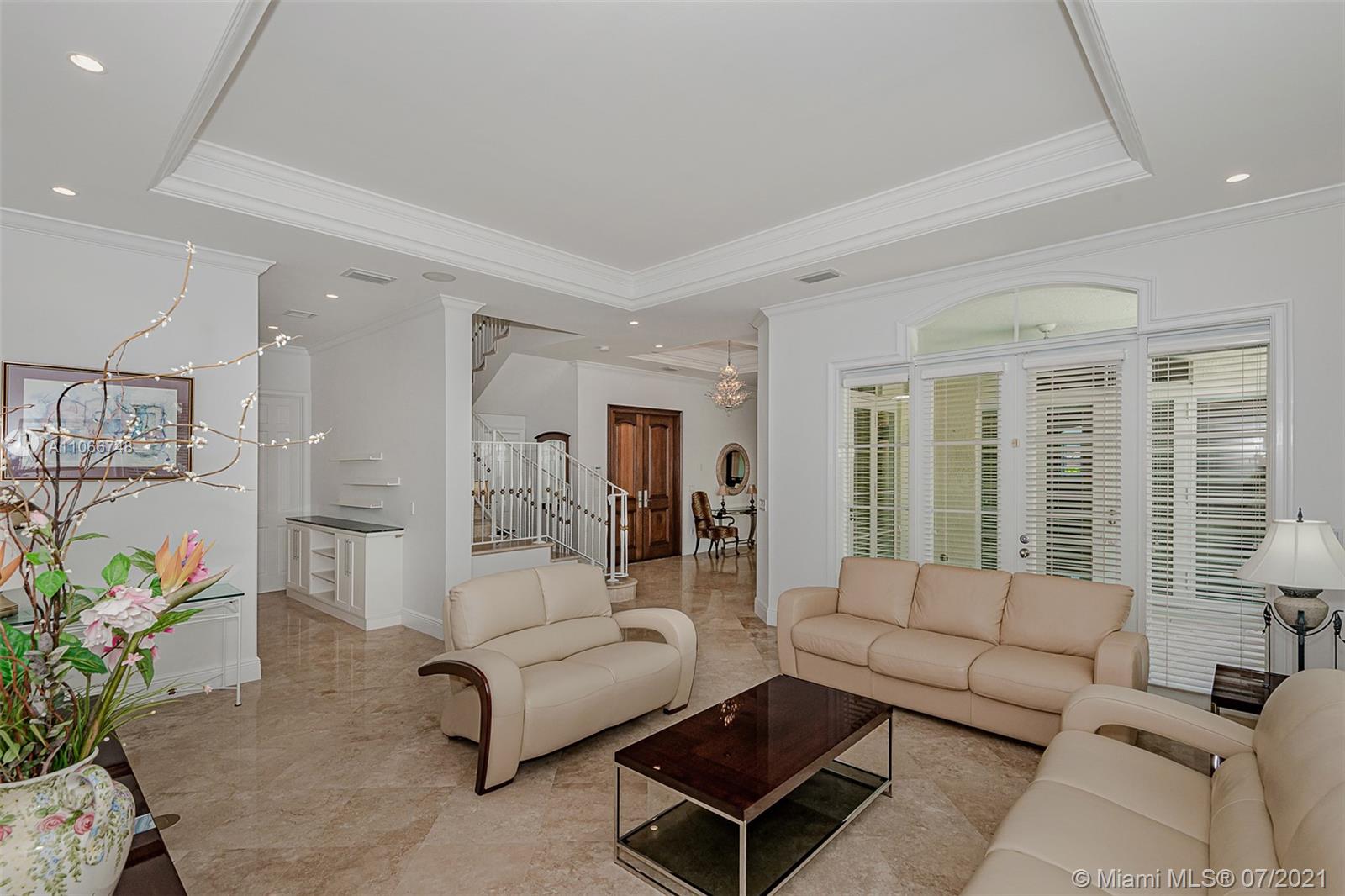 442 Woodcrest Road Key Biscayne, FL 33149 - Photo 7 of 48 a living room with furniture and a large window