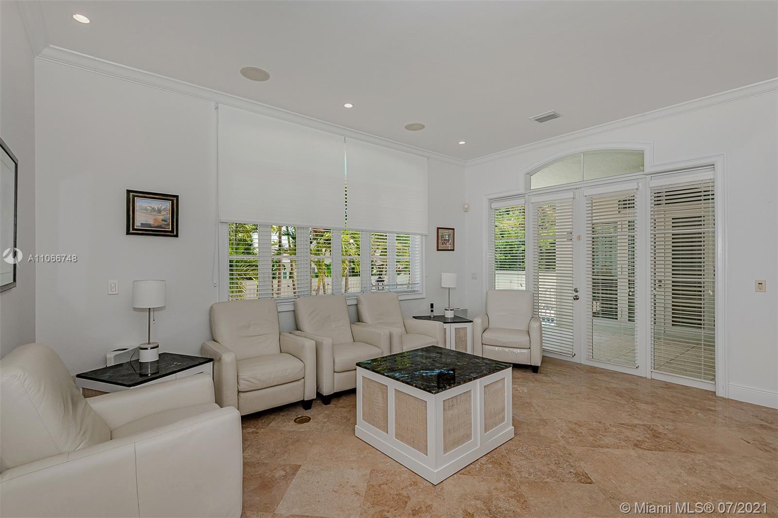442 Woodcrest Road Key Biscayne, FL 33149 - Photo 10 of 48 a living room with furniture and a floor to ceiling window