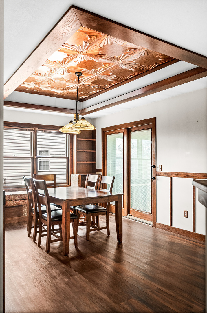 1515 Belclare Road Normal, IL 61761 - Photo 11 of 40 a view of a dining room with furniture window and wooden floor