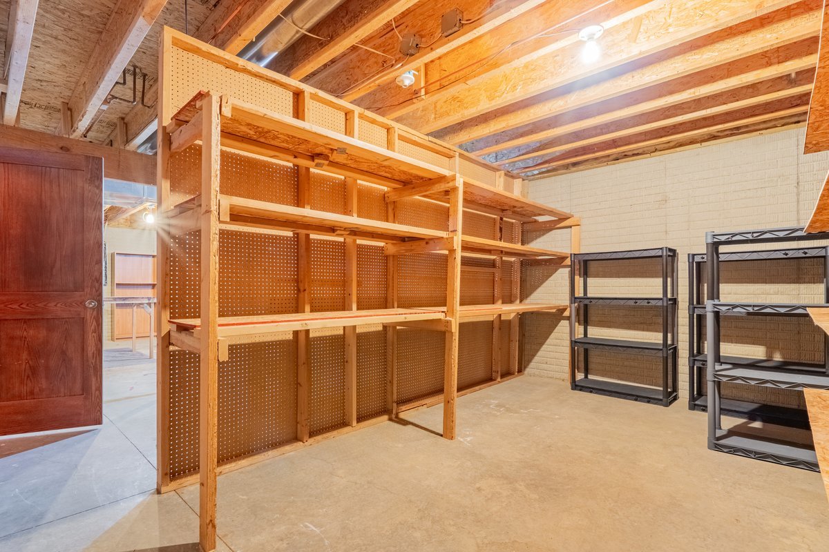 1515 Belclare Road Normal, IL 61761 - Photo 21 of 40 a view of an empty room with wooden shelves