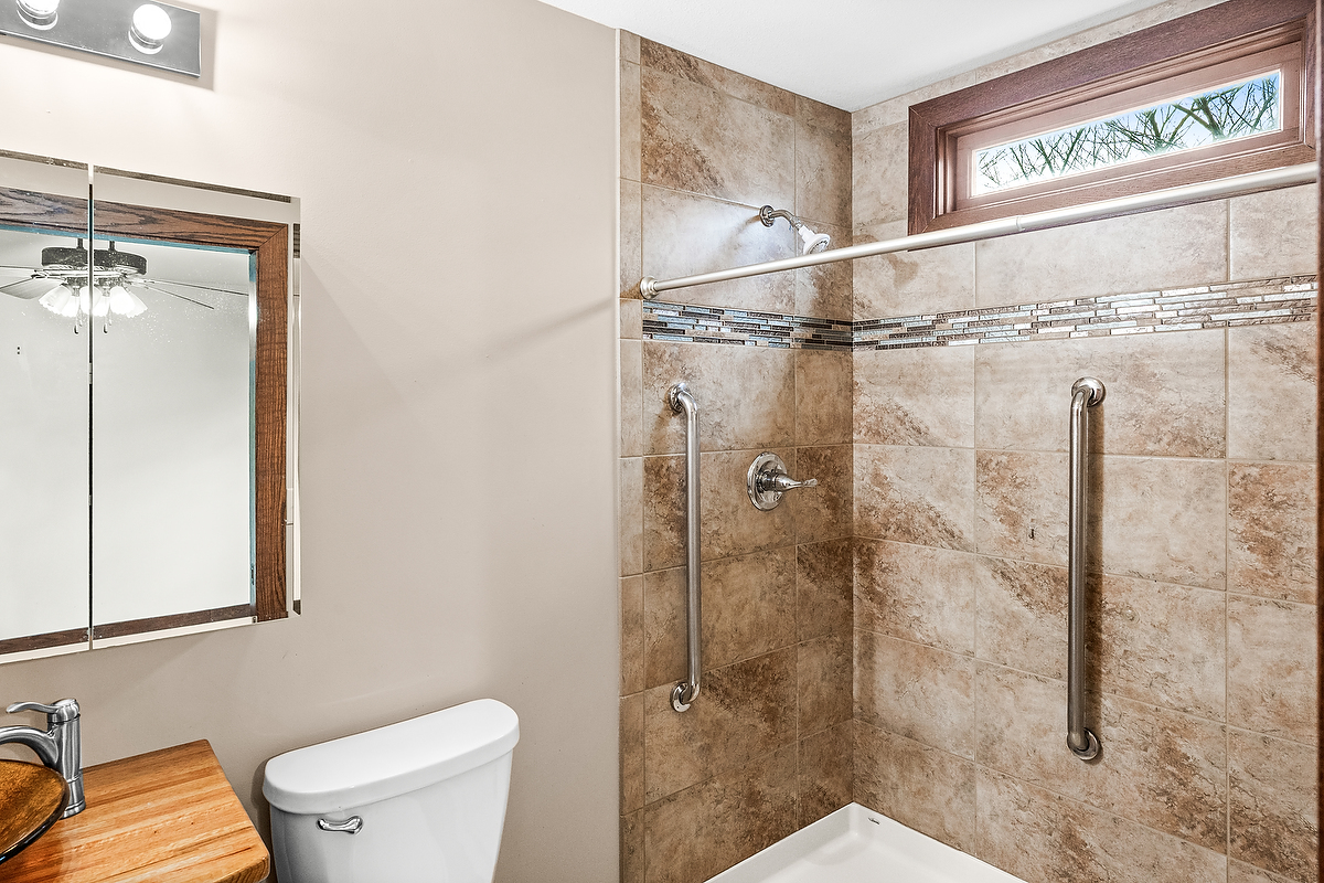 1515 Belclare Road Normal, IL 61761 - Photo 25 of 40 a bathroom with a shower and a toilet