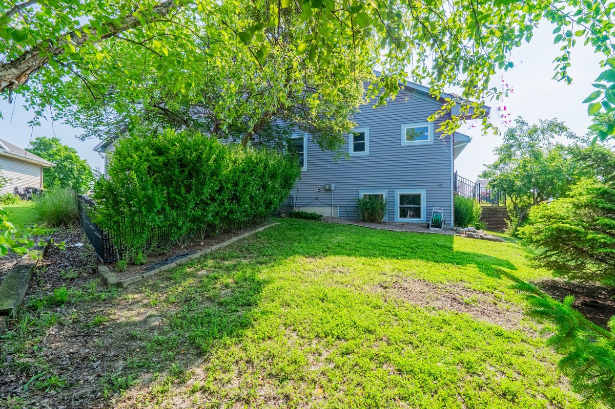 1515 Belclare Road Normal, IL 61761 - Photo 39 of 40 a front view of a house with garden