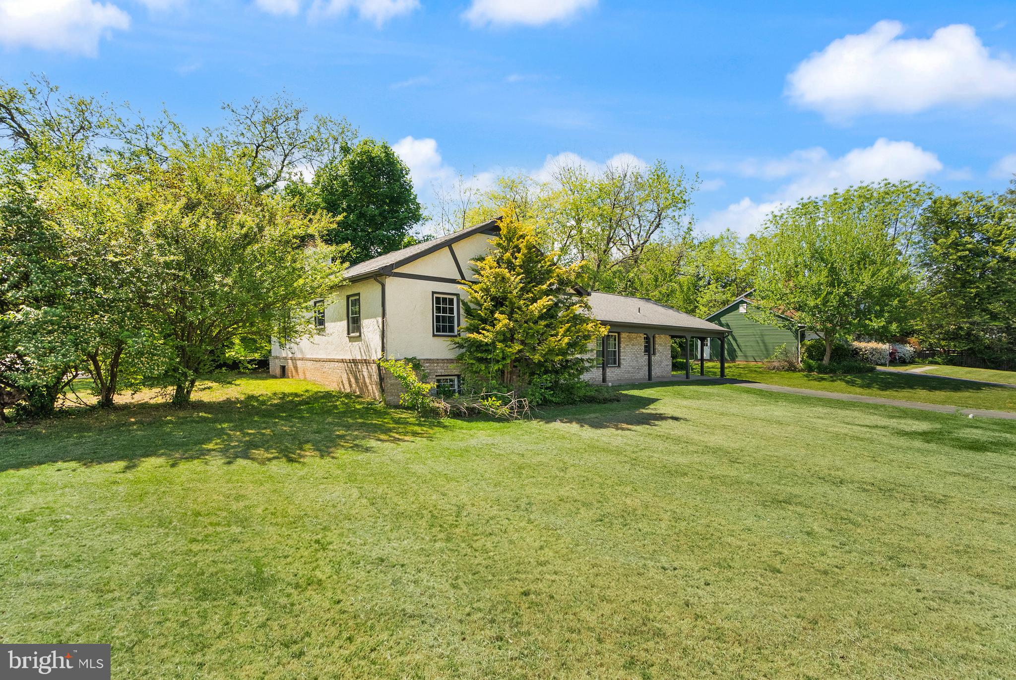 1600 Chain Bridge Road McLean, VA 22101 - Photo 5 of 22 a front view of a house with a yard