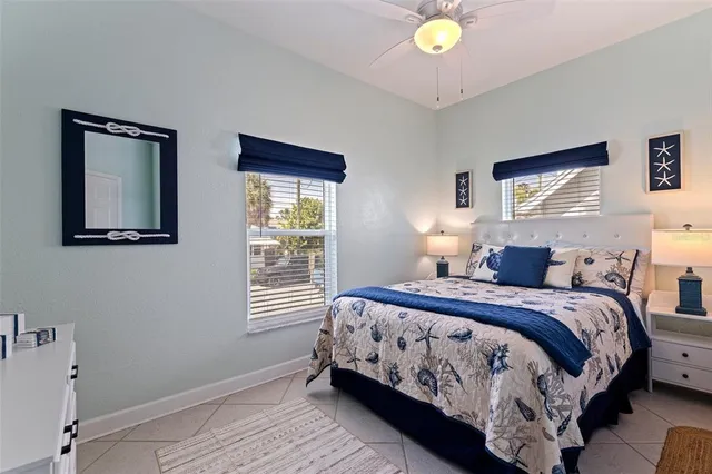 a bedroom with a bed table and window