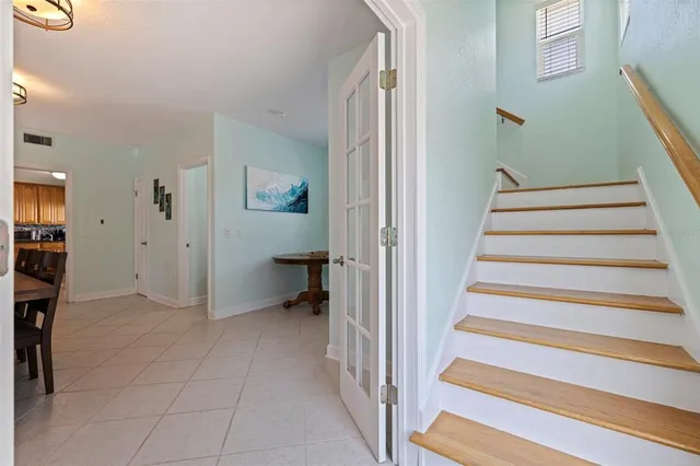 a view of entryway and hall with wooden floor