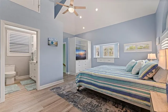 a bedroom with a bed and a view of bathroom