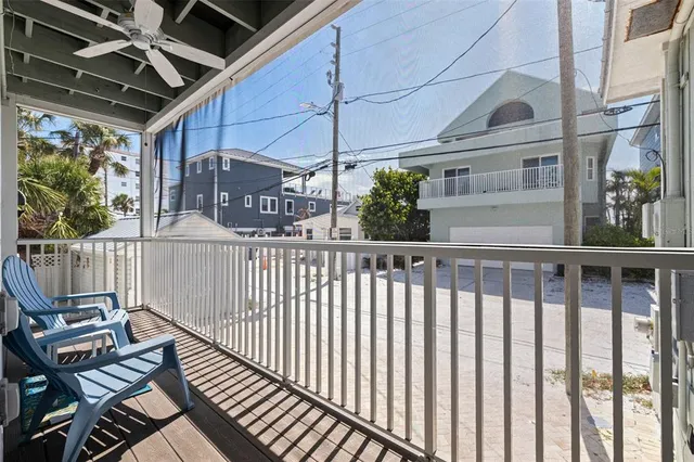a view of a balcony with wooden floor