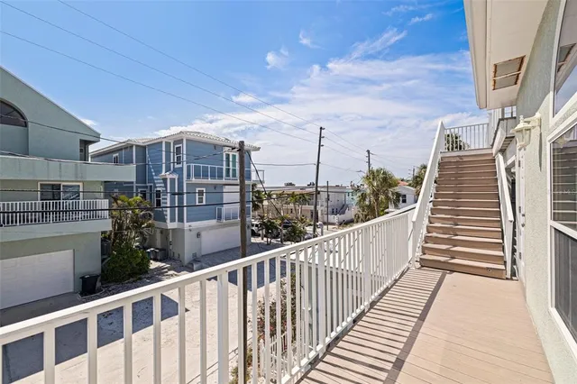 a view of balcony with wooden floor