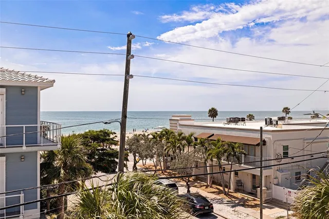 a view of balcony with wooden floor