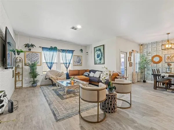 a living room with furniture and a table