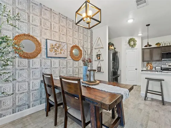 a view of a dining area with furniture and chandelier
