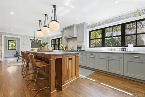 a kitchen with a table chairs and a sink