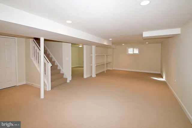 a view of an empty room with stairs