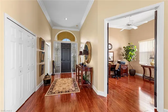 a very nice looking room with wooden floor and furniture