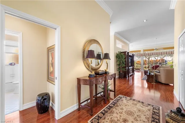 a view of living room with furniture and wooden floor