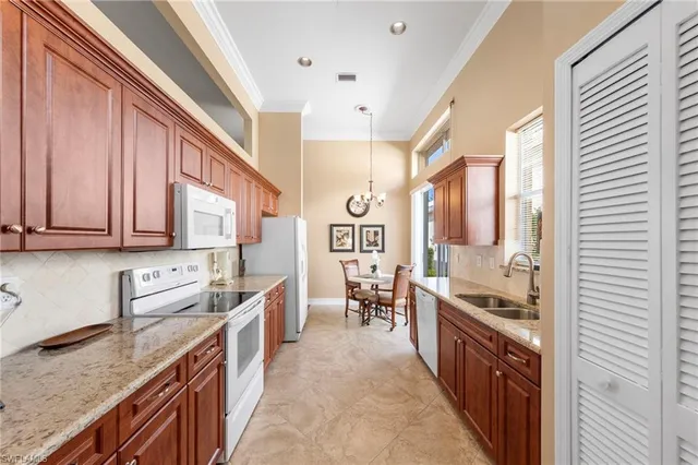 a kitchen with stainless steel appliances granite countertop lots of counter top space and wooden floor