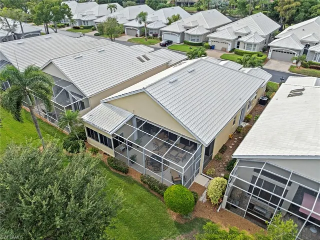 an aerial view of a house with a yard