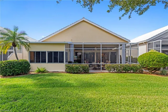 a view of a house with a yard and plants