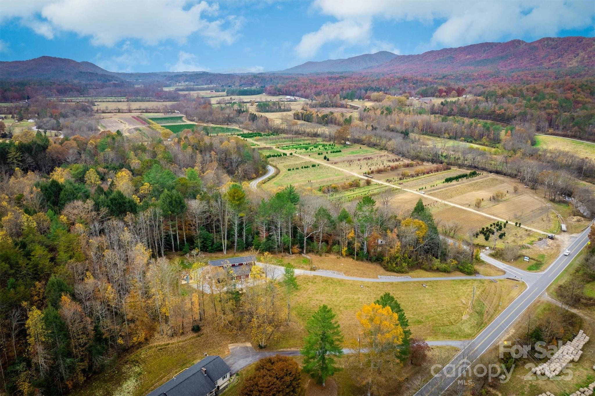 4447 Steeltown Road Lenoir, NC 28645 - Photo 13 of 42 a view of a swimming pool with mountains in the background