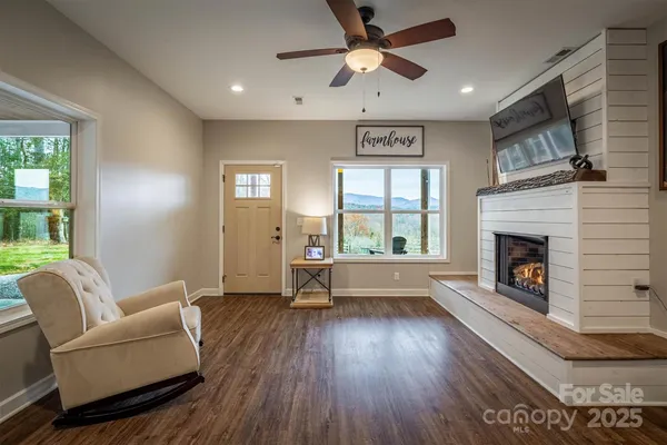 a living room with furniture and a fireplace