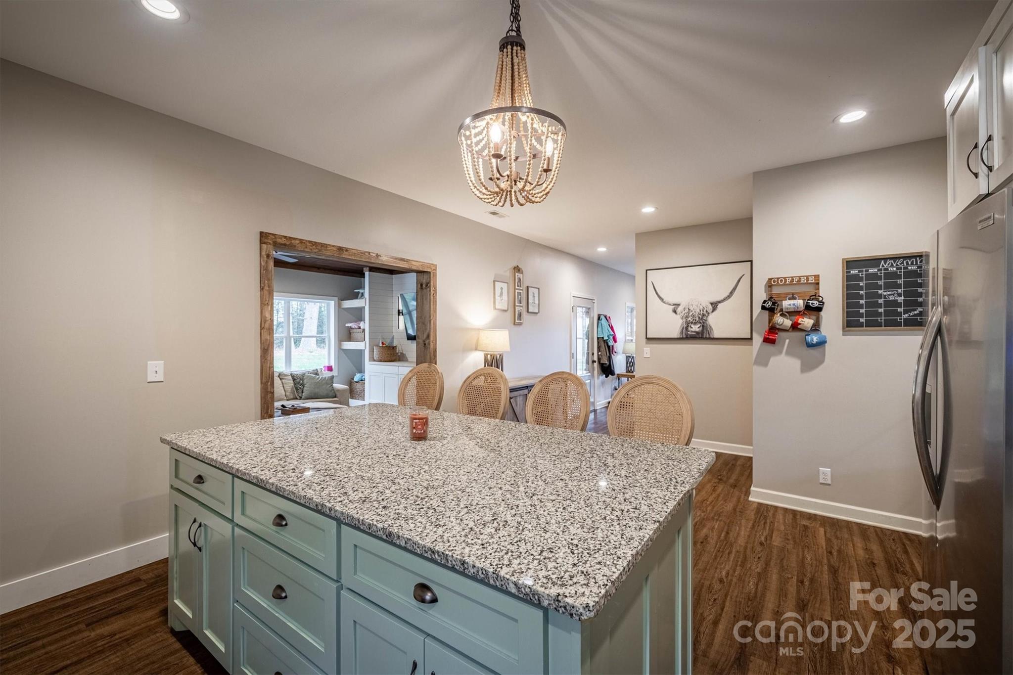 4447 Steeltown Road Lenoir, NC 28645 - Photo 25 of 42 a view of a kitchen wooden cabinets and a chandelier