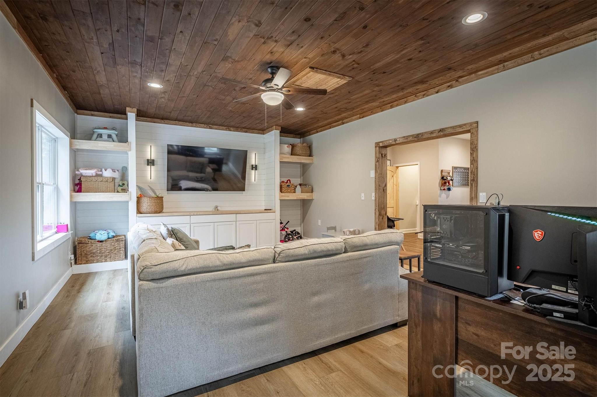 4447 Steeltown Road Lenoir, NC 28645 - Photo 27 of 42 a living room with furniture and a flat screen tv