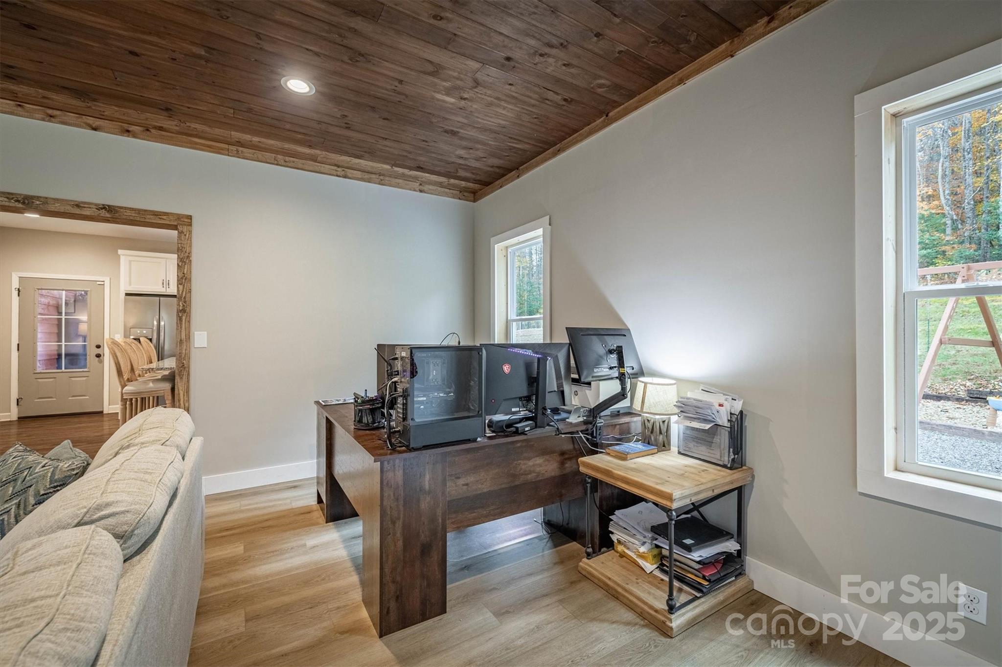 4447 Steeltown Road Lenoir, NC 28645 - Photo 28 of 42 a living room with furniture a piano and a window