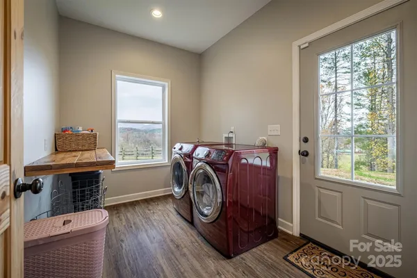 a utility room with closet dryer and washer